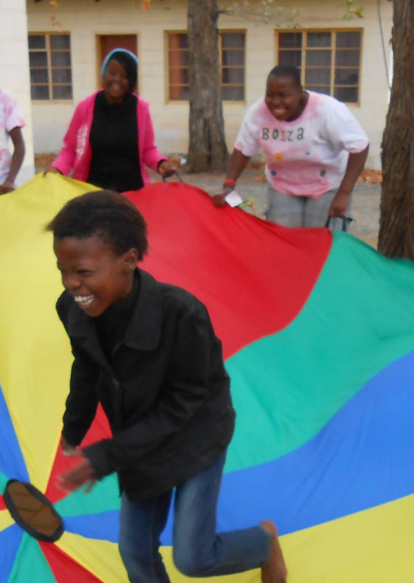 group of people enjoying parachute games