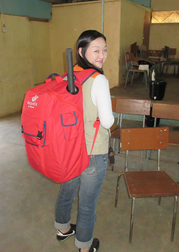 a person with the basepack on her back