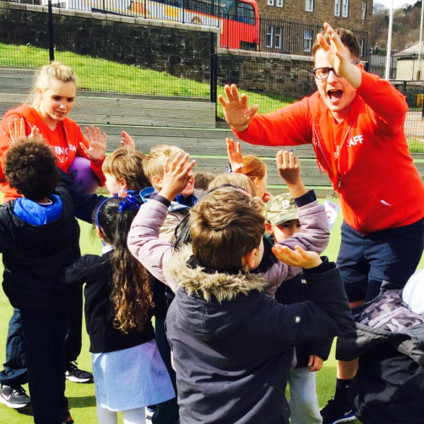 staff members delivering active play to children