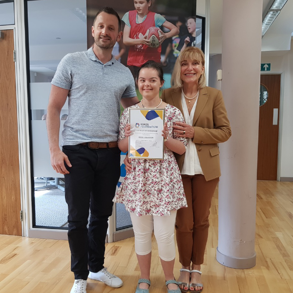 Isobel a work placement coach receiving her certificate