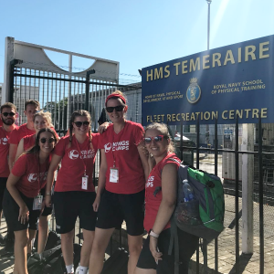 a group of red tops outside a royal navy training ground