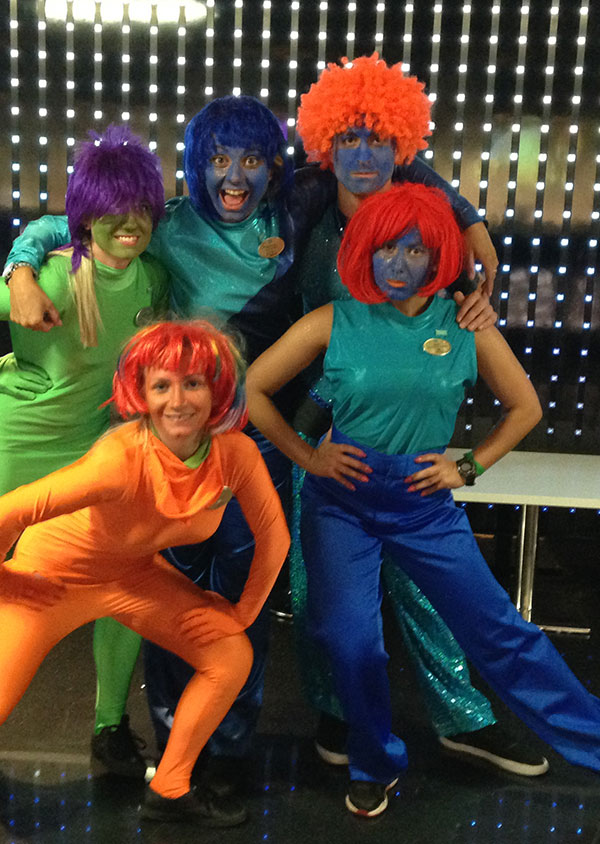 cruise ship staff in fancy dress and face paint on