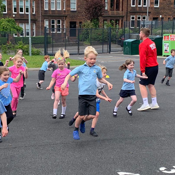 School childrden taking part in sports activities in the playground