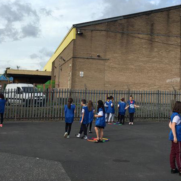 Children in the playground enjoying active leaders.